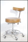 A retro 1970's medical / Industrial swivel office