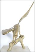 A 20th century vintage brass cast sculpture of an