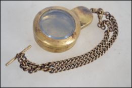 A believed military brass compass case with bevell