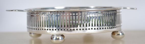 A silver hallmarked champagne / wine bottle stand