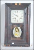 A walnut frame American striking eight-day wall cl
