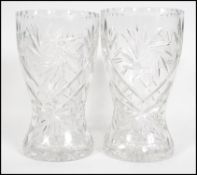 A pair of large crystal cut glass cases with unusual star design. Thes vases of bulbous form with