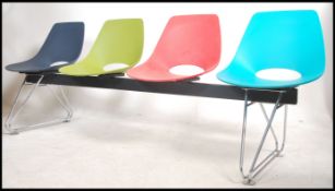 A contemporary Charles & Ray Eames style 4 seat be