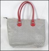 A ladies contemporary Jack Russell leather and decorative fabric upholstered handbag complete with