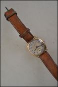 A vintage gents 9ct gold Omega wristwatch set to a