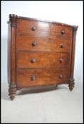 A Victorian large mahogany bow front chest of draw