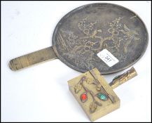 A 19th century Chinese polished bronze hand mirror
