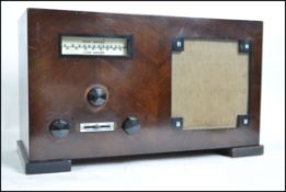 A vintage 1930's wooden cased Mullard valve radio