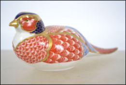 A Royal Crown Derby  gold stopper collectors paper