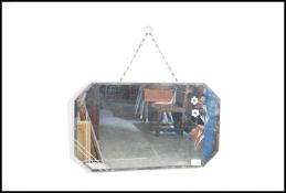 A vintage mid 20th century frame-less wall mirror