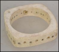 A ladies 20th century Chinese bone cuff bangle of