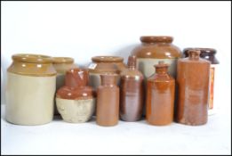 A group of 9 vintage stoneware storage jars and bo