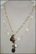 Two ladies silver necklaces, one being set with a