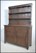 A Jaycee oak Jacobean revival dresser having carve