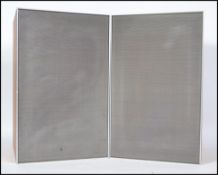 A pair of retro teal wood music speakers by Leak, the teakk cased with a chrome surround having