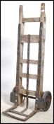 An early 20th century sack truck of wooden and cas