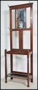 A 1930's oak hallstand / umbrella stand raised on