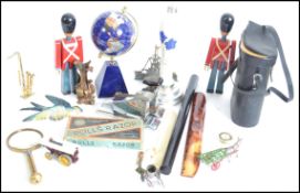 A dealers lot to include wooden soldiers, a boxed