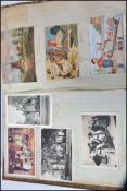A 20th century postcard album within old ledger ha
