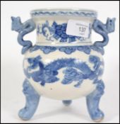 A Chinese blue and white ceramic censor raised on