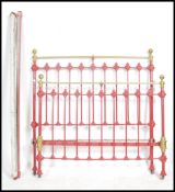 A Victorian brass & cast iron metal double bed com