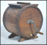 An early 20th century oak butter churn having cent
