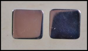 A pair of silver gentlemans cufflinks, each with a