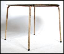 An industrial metal garden table having a large ci