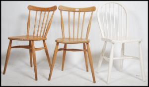 A pair of vintage / retro Windsor spindle back elm