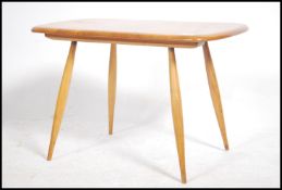 A 20th century Ercol ' Windsor ' golden dawn beech
