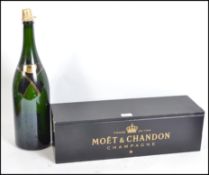 A 20th century large Moet & Chandon champagne bottle box in black with gilt notation complete with