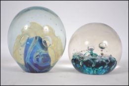 A 20th century collectable paperweight signed to the base Eickholt along with another signed