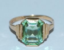 A hallmarked 9ct gold ring set with an emerald cut