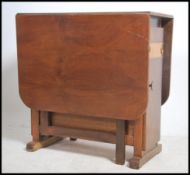 A mid century retro drop leaf harvest table of ply