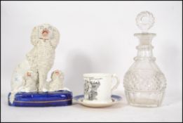 A group of 19th century ceramics to include a Staffordshire Poodle figure group, a Dresden tea caddy
