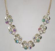 A vintage 1950s aurora rhinestone necklace in a gold tone setting having a box clasp. Measures 43cms