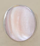 A sterling silver 925 signet ring having central mother of pearl panel. Weighs 13.8 grams size T.