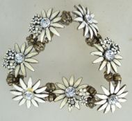 A fantastic Danish bracelet having large white enamel flowers with central clear stones by