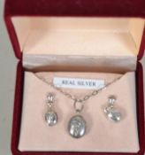 A vintage silver 1980s pendant and earring set in original box. Marked 925 weighs 2.75 grams