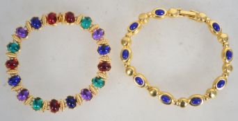 Two gold tone Joan Rivers link bracelets set with multicoloured and blue stones . Measures approx