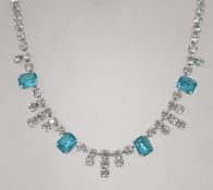 A vintage 1950s rhinestone necklace having round cut rhinestones and turquoise emerald cut
