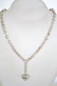 A sterling silver 925 dual rolo link necklace chain having a silver heart drop pendant and a