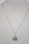 A sterling silver necklace chain with bolt ring clasp having a pierced square locket pendant with