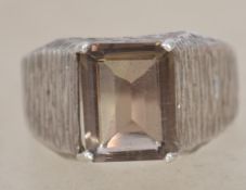 A sterling silver 925 modernist Brutalist ring having naturalistic bark effect shoulders with a