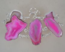 A pink banded agate silver plated bracelet having a toggle clasp. Measures 22.5 cms long and 3.