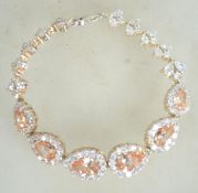 A sterling silver 925 bracelet chain having CZ flower spacers and citrine glass stones adorned