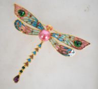 A large gold tone Plique a Jour Joan Rivers brooch in the form of a Dragonfly set with a central