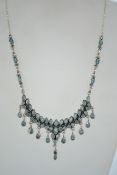 A silver and blue topaz statement necklace marked 800 bearing London Hallmark for 2002. Measures