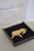 A vintage 1980s large tiger brooch in original box with rollover catch. Measures 7.2 cms wide.
