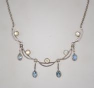 A silver blue topaz and mother of pearl necklace measuring 44cms long weighs 12.7 grams.